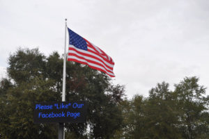 Flagpole and sign at Fair Harbor RV Park and Campground